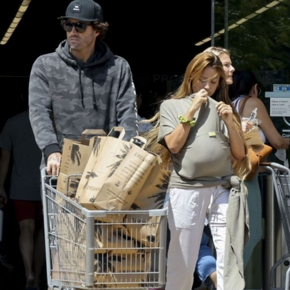 brody jenner and tia blanco carrying baby in a boba wrap
