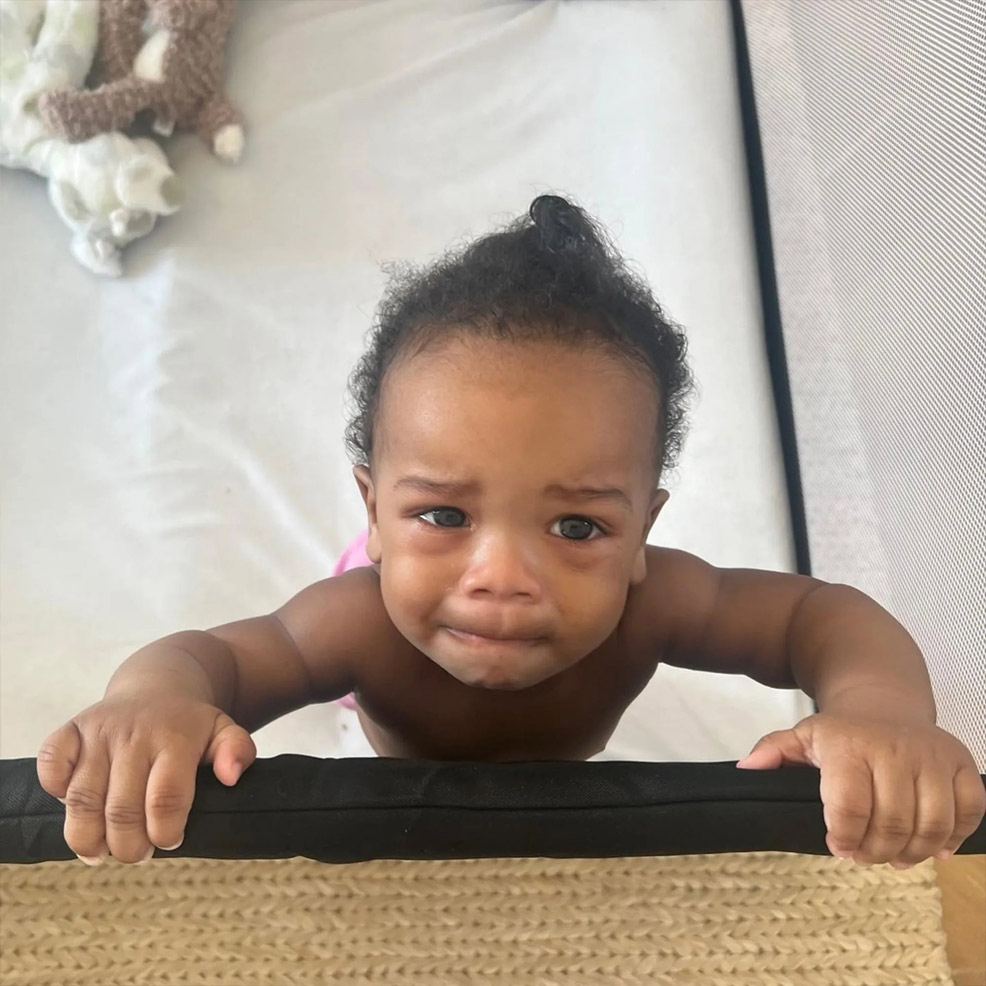 rihannas baby in a 4moms breeze travel crib