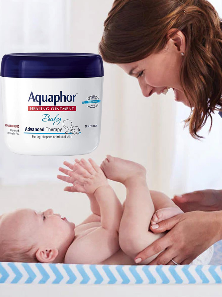 a mom putting aquaphor onto baby skin
