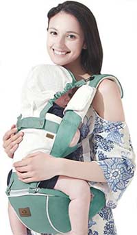 a mother carrying an infant in a green bebamour carrier